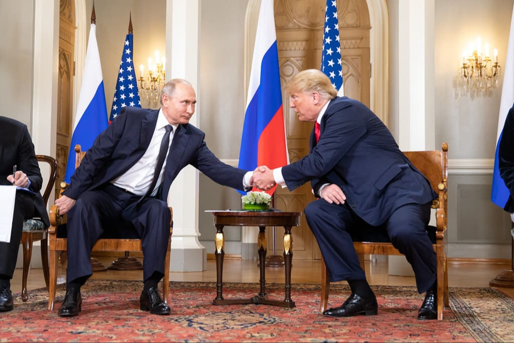 Presidents Trump and Putin greet each other on the red carpet at Joint Base Elmendorf–Richardson in Alaska ahead of their high-stakes summit.