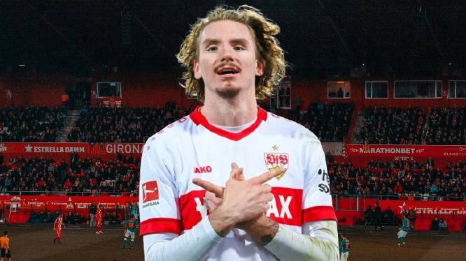 Newcastle Secure Nick Woltemade in Club-Record Transfer That Shakes Transfer Market 2 Nick Woltemade, German striker, standing on a football pitch during a match, wearing his VfB Stuttgart jersey before his transfer to Newcastle United.