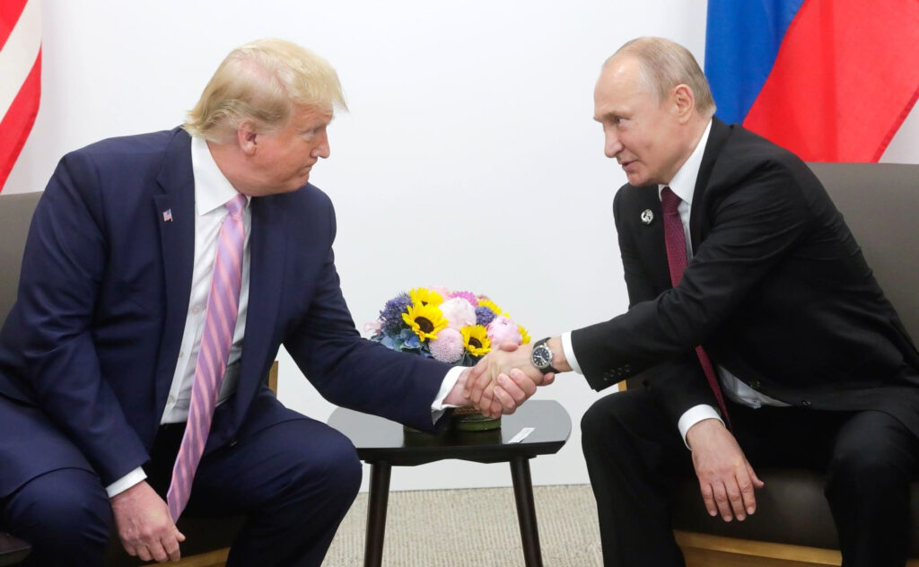 Trump-Putin Summit in Alaska: Tense Ceasefire Talks Begin 2 Trump and Putin shake hands on the tarmac in Alaska, flanked by military jets and red carpet for summit arrival.